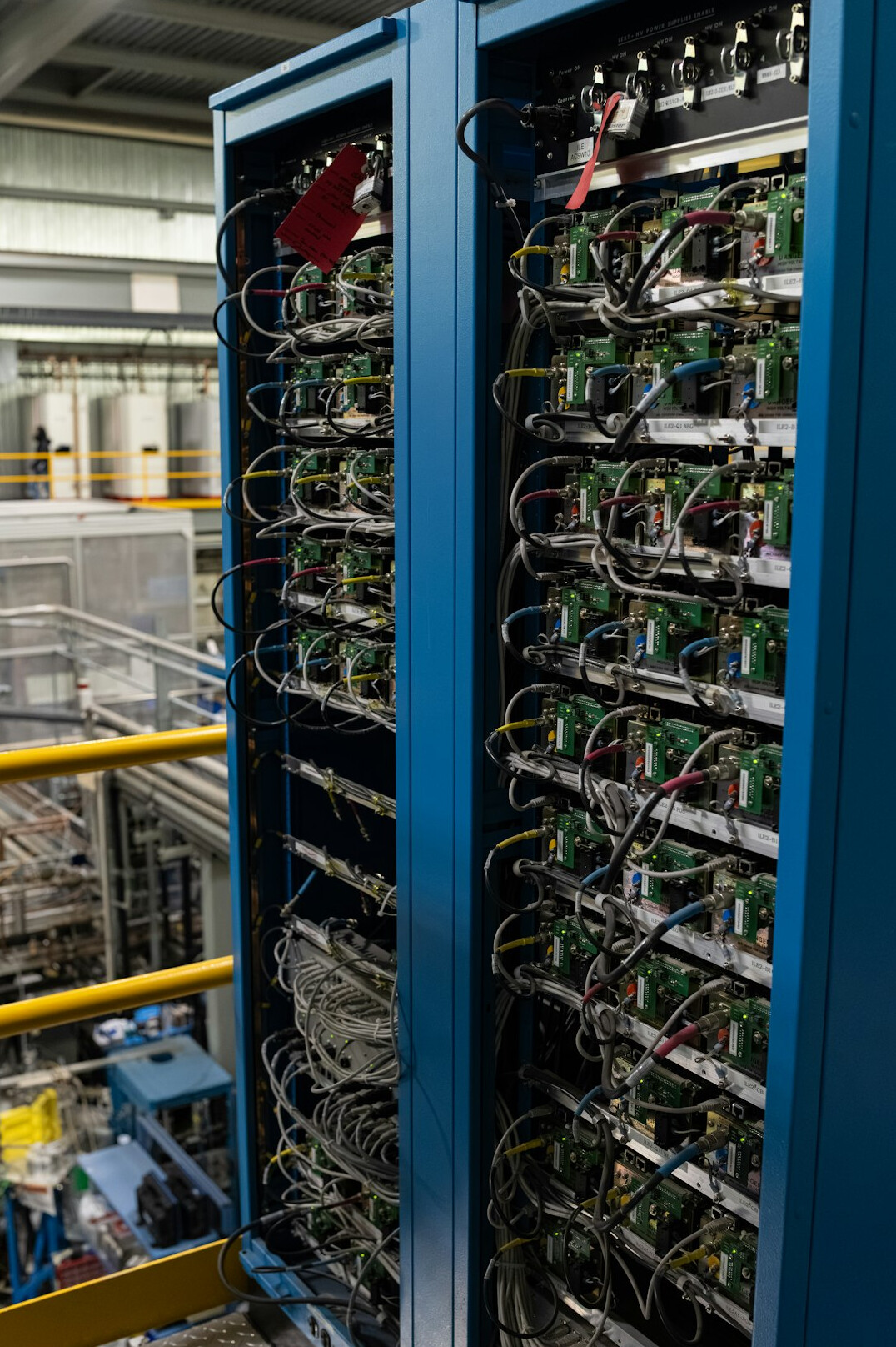 Rows of illuminated server racks in a data center